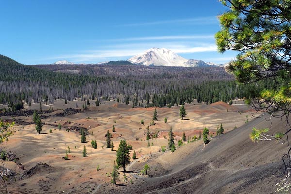 Snow covered Lassen Peak viewed from Cinder Cone, with foreground of the Painted Dunes.  Photo: Dee Wong